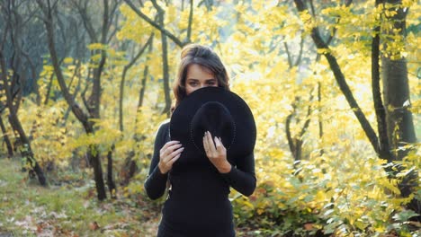sunny autumn day in park. young woman spending time in autumn park