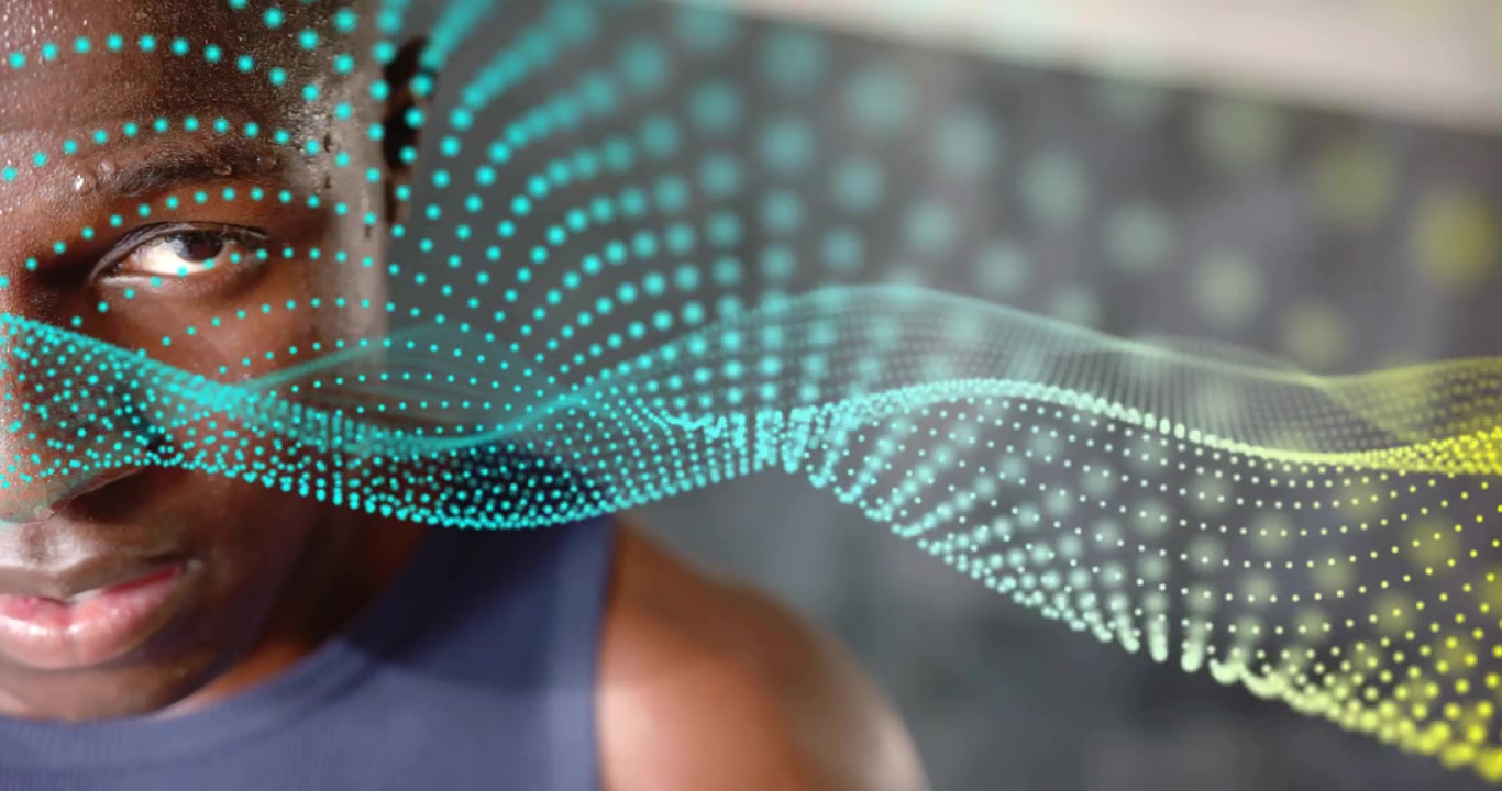 Male athlete focusing with digital waveform emerging from left visualizing biometric data