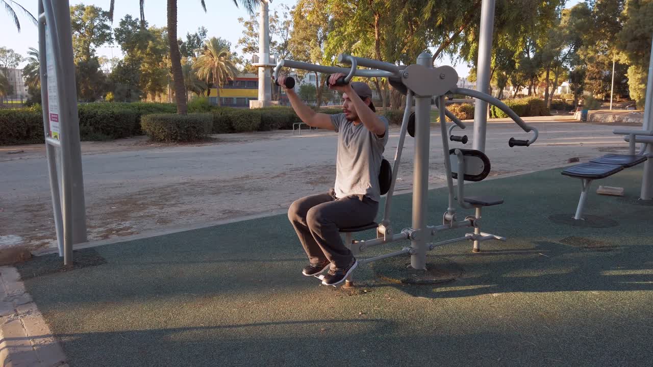 young man, lift your own weight in fitness equipment.