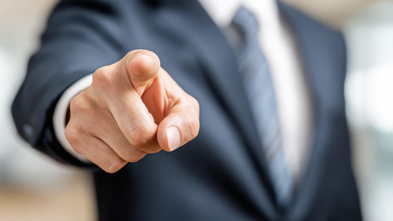 Confident Businessman Assertively Pointing Forward in a Professional Setting, Symbolizing Leadership and Direction in Decision-Making Scenarios