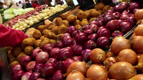 hand selecting vegetables at melbourne market