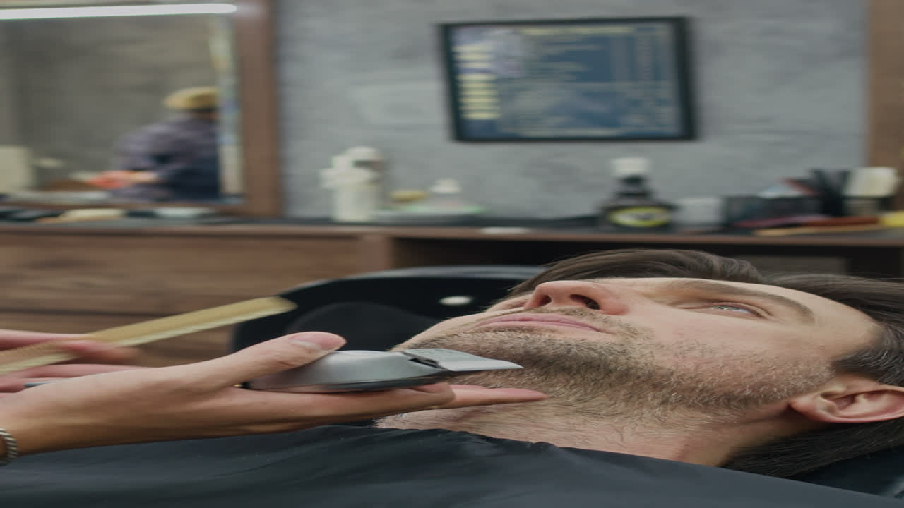 Caucasian Man Getting Beard Shaved at Salon