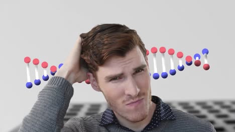 animation of dna strand spinning over worried caucasian businessman