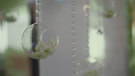 Decorative-element-of-glass-ball-with-dry-flower-petals