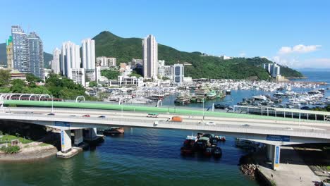 Aberdeen-harbour-and-skyline-in-southwest-Hong-Kong-island-on-a-beautiful-day,-Aerial-view