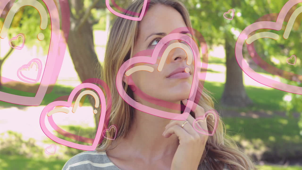 Woman outdoors with pink heart animations overlaying her thoughtful expression
