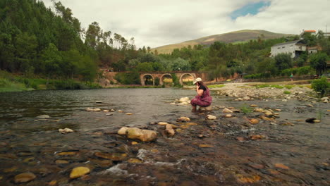 girl in the river in a summer day
