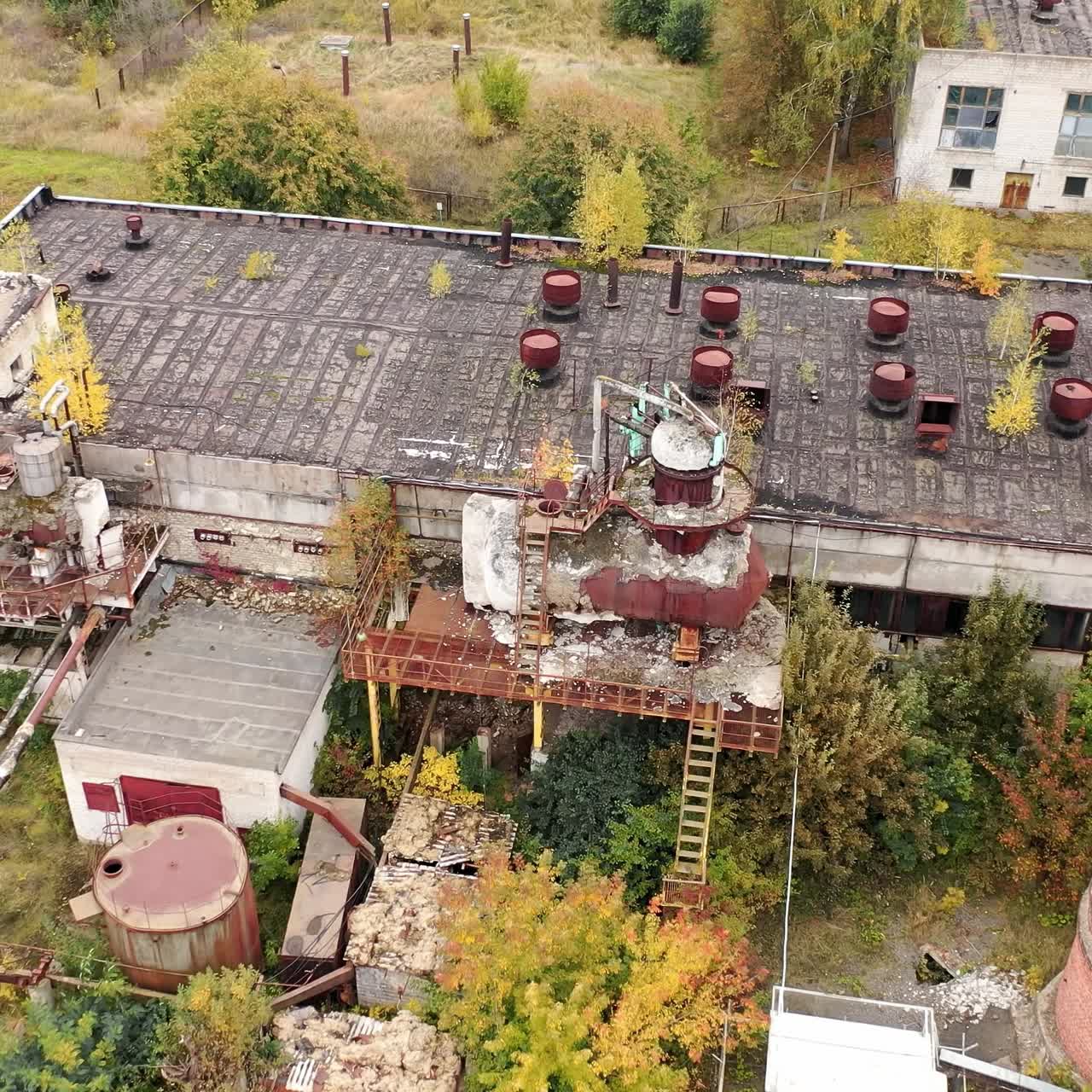 Old ruined empty industrial architecture. Abandoned destroyed factory territory