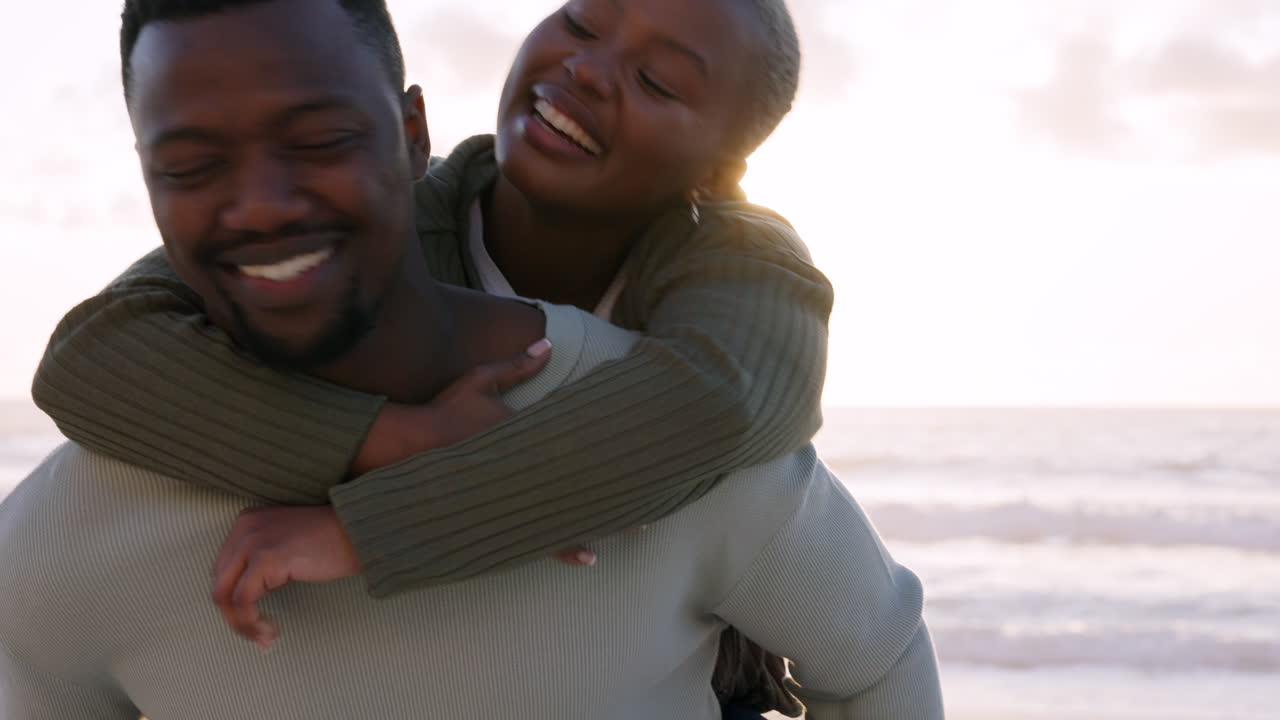 Beach, love and a piggyback