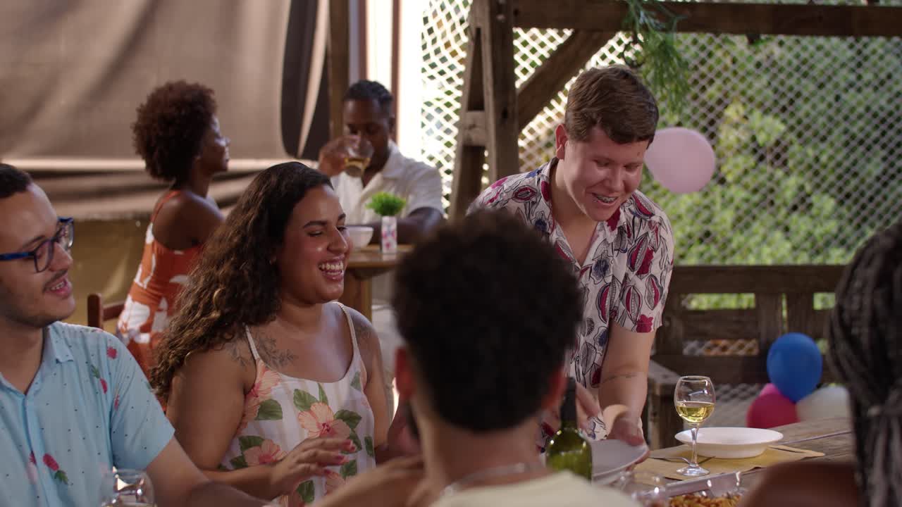 Friends enjoying an outdoor party meal