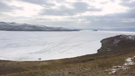 frozen lake baikal with buddhist stupa