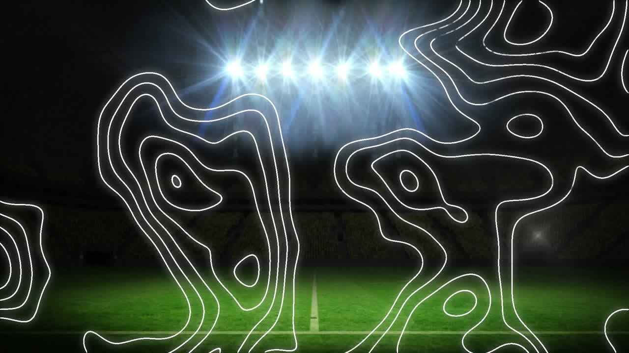 topografía contra contra las luces de inundación y el estadio deportivo en el fondo