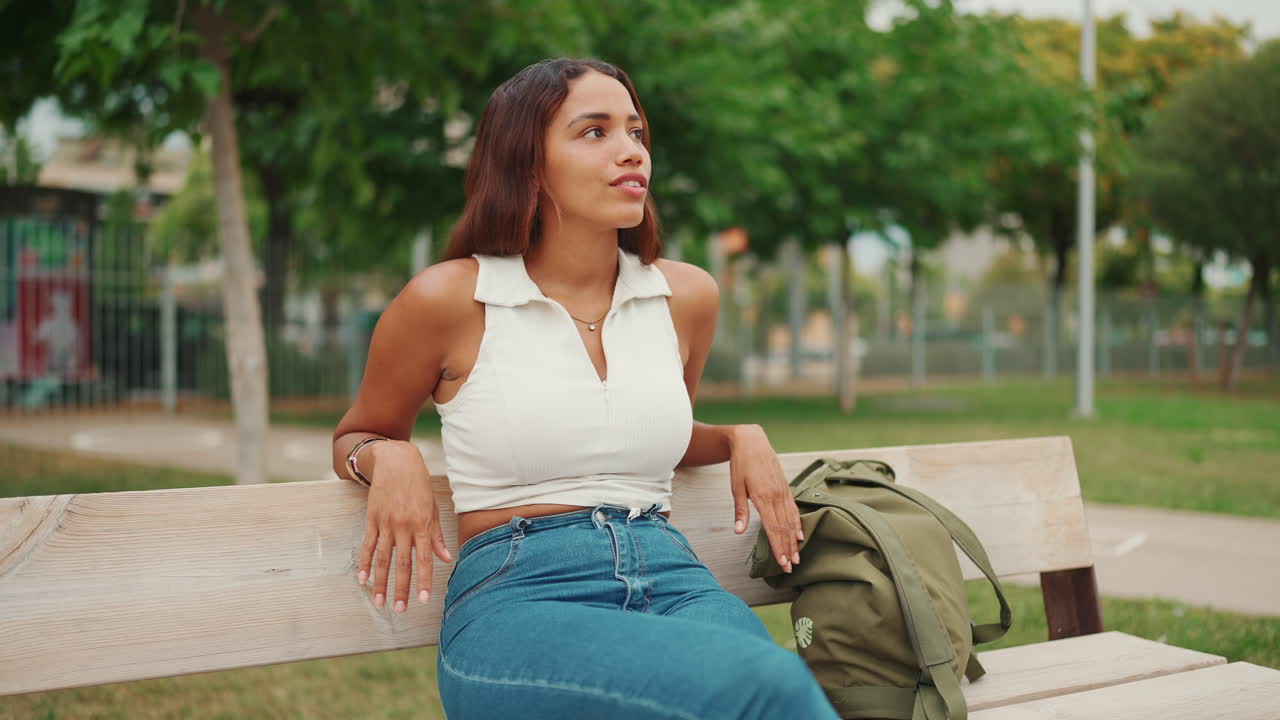 Woman relaxing on a bench in the park