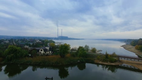 river view with power plant and houses