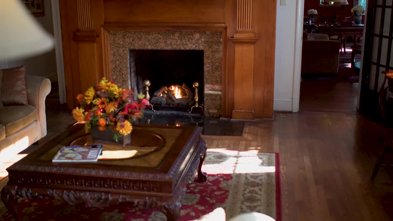Cozy Living Room Interior with Fireplace and Floral Arrangement