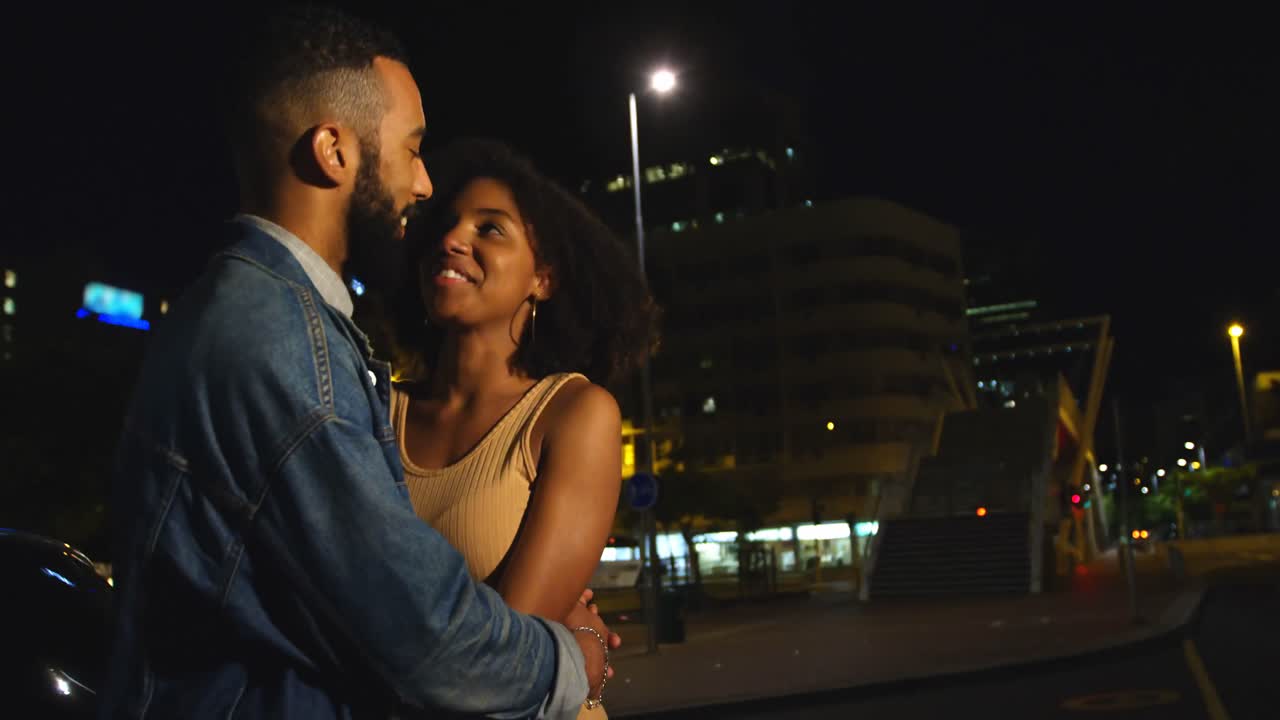 Couple interacting with each other in city street 4k