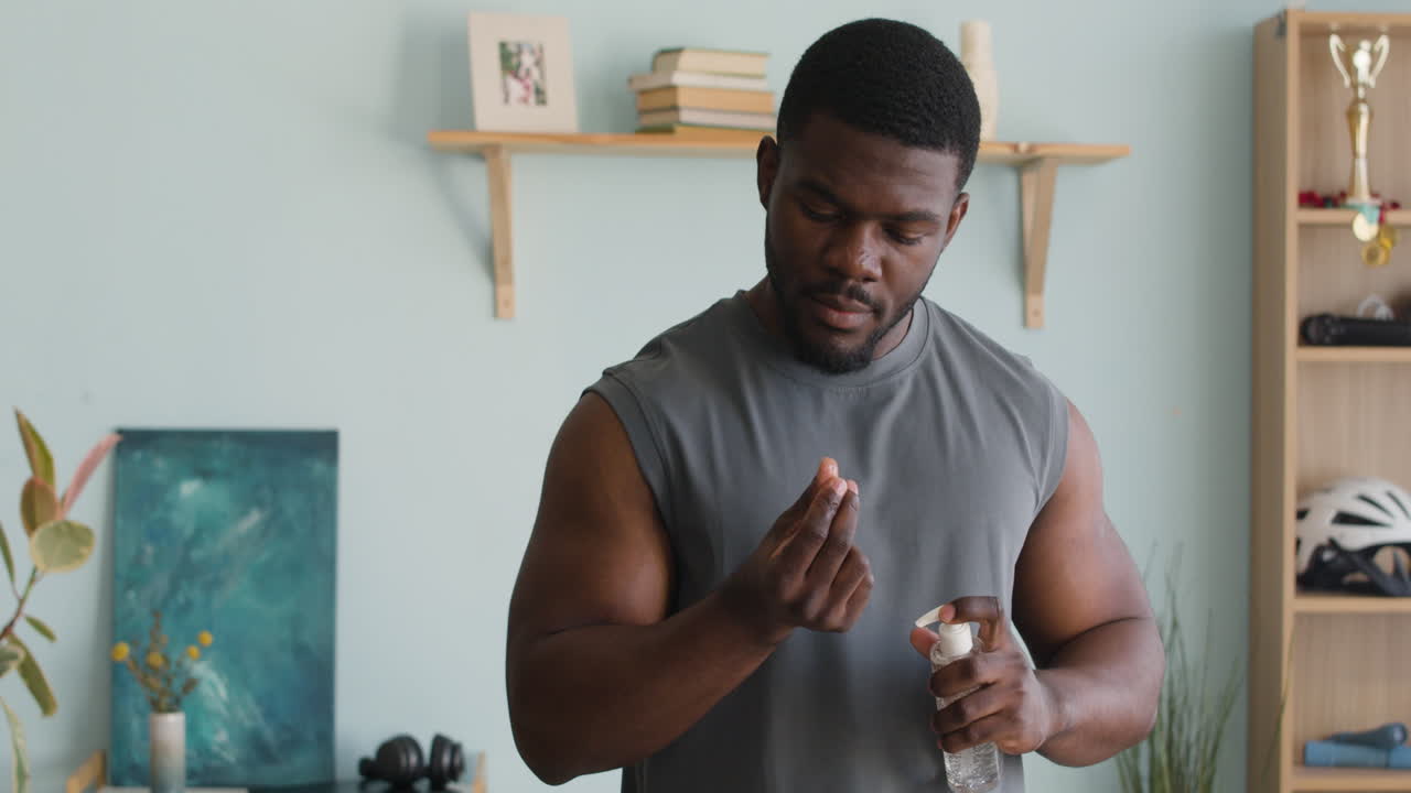 Man using hand sanitizer for personal hygiene