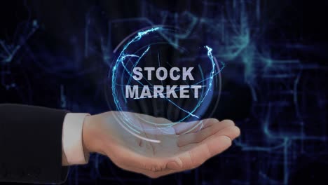 painted hand shows stock market