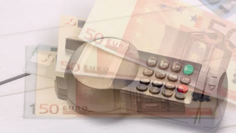 Animation-of-euro-banknotes-falling-over-payment-terminal