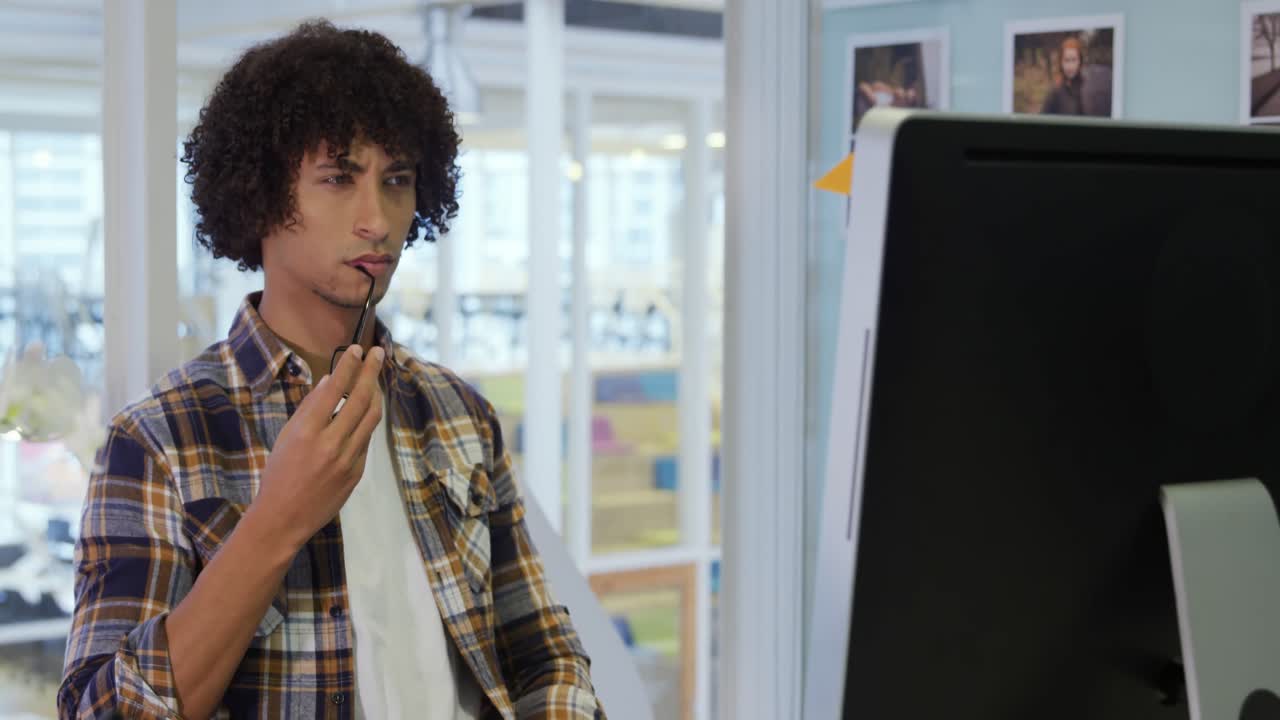 Young man working in a creative office