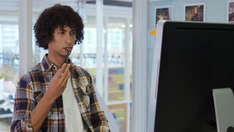 Young man working in a creative office