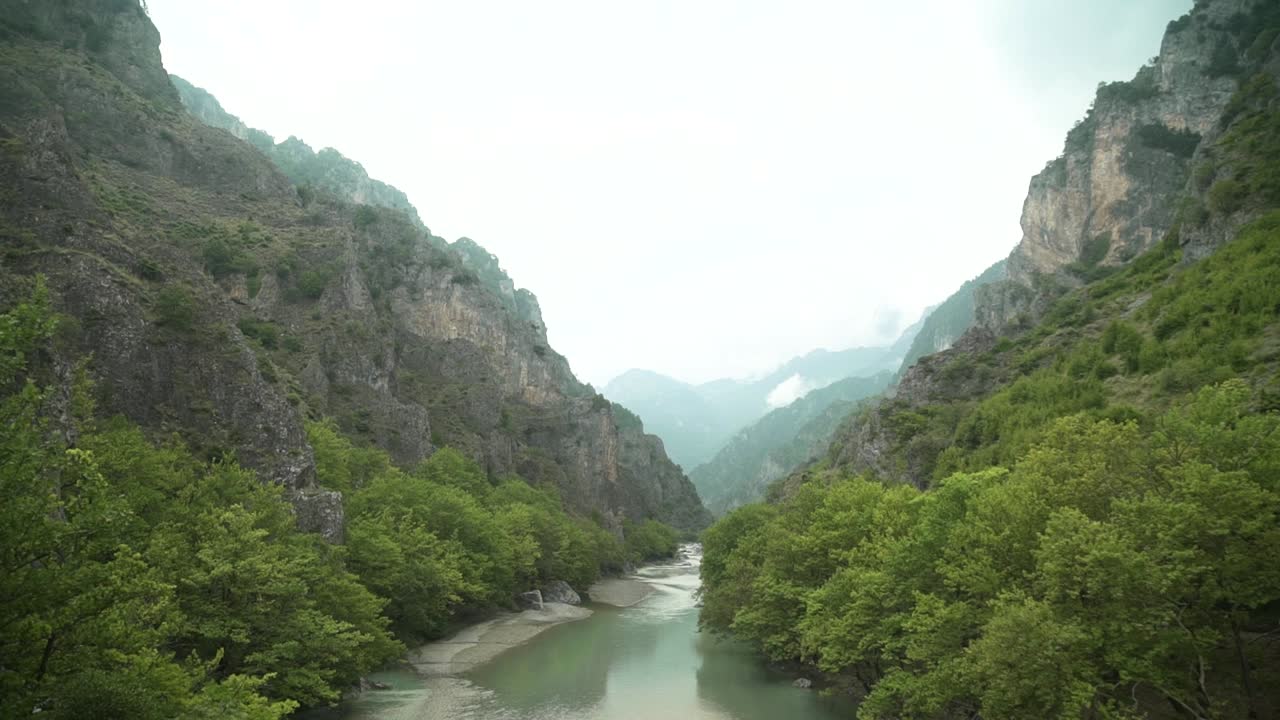 day shot of amazing view of Aoos river at Konitsa  Epirus Greece  beautiful green mountain and  reflections at river  waters nature lifestyle