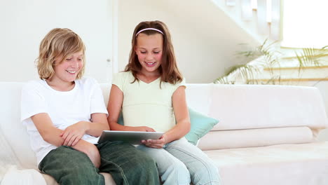 children playing with a tablet computer