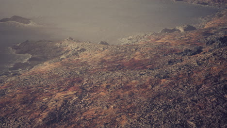 beautiful view of foggy mountains with a reflection in a lake