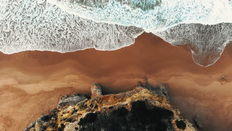 aerial: view from above of the beach and cliffs, slowly flying forward