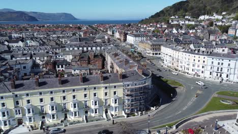 beachfront aerial view llandudno seaside coastal holiday town tourism resort hotels pull back left pan