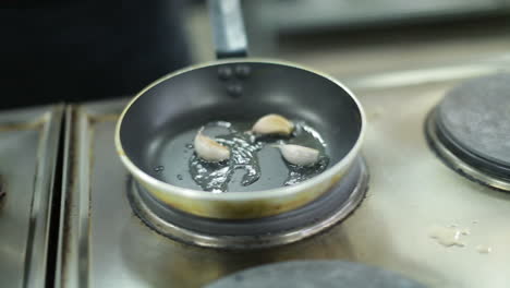 onion frying in a pan. fried onions in a frying pan in oil, for cooking