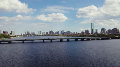 Aerial-Shot-Of-Boston-Skyline,-Cars-Driving-On-Harvard-Bridge