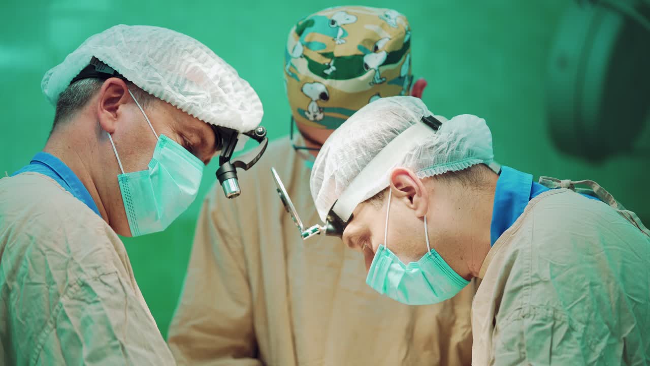 Medical Team Performing Surgery. Portrait of professional surgeons performing surgery on patient in the hospital operating room