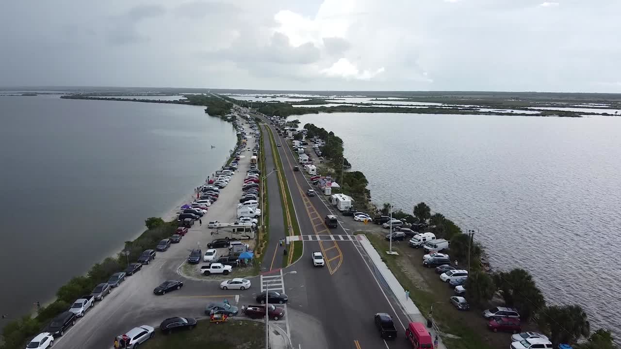 Aerial view of vehicles lined up on the coast awaiting the delayed historic SpaceX-NASA Falcon Heavy launch.