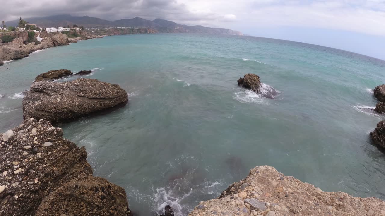 playa españa malaga nerja en un día nublado de verano usando un dron y una cámara de acción estabilizada-2