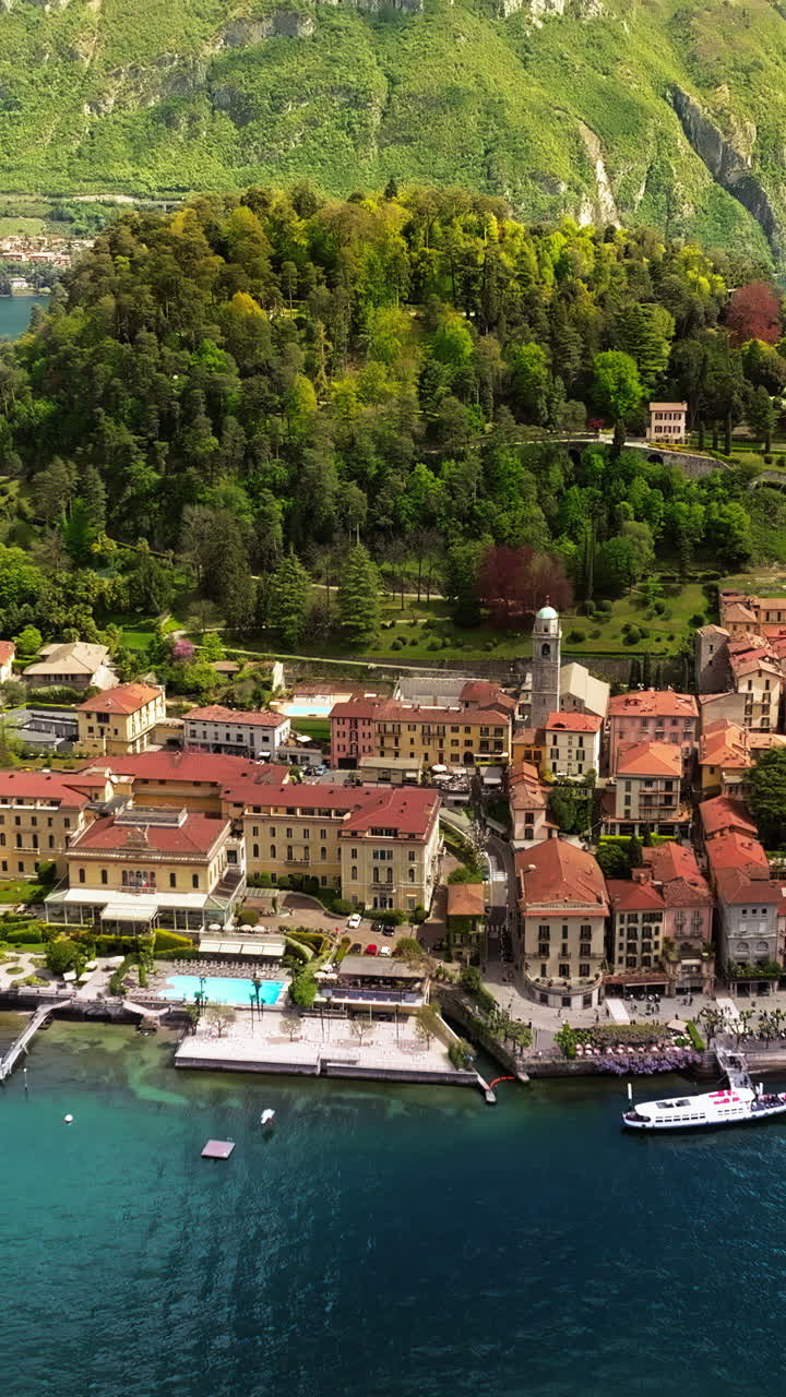 Aerial view of ship navigating on Lake Como on a sunny day near Bellagio, Italy. Vertical