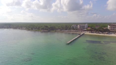 slow pan up from the water to caribbean fishing village