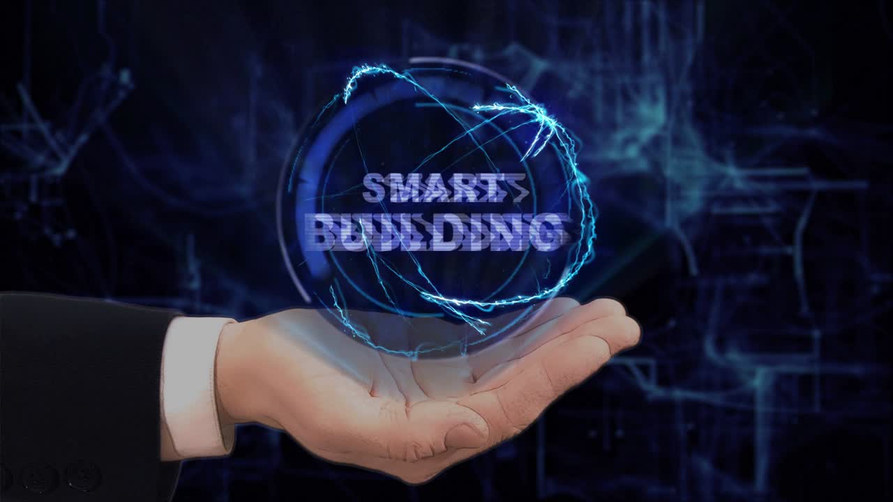 Painted hand shows concept hologram Smart building on his hand