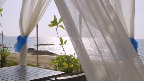 Romantic-Canopy-Blowing-and-Waving-by-Wind-at-The-Beach