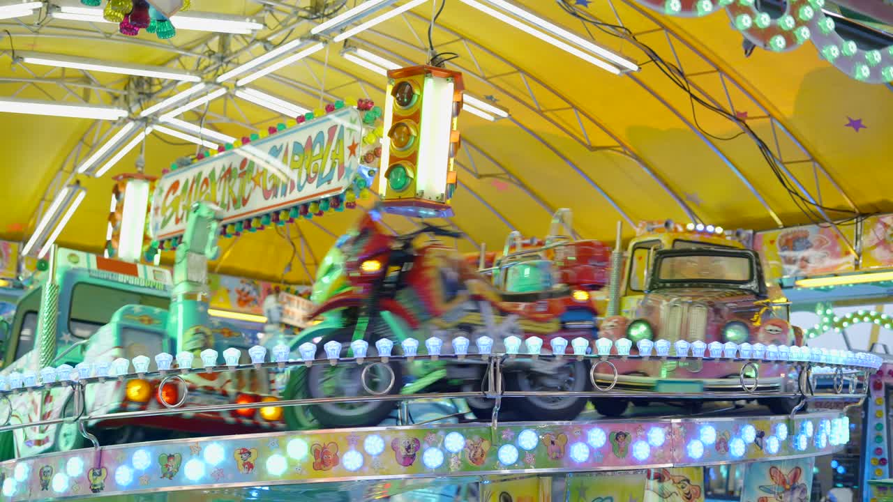 Colorful Kiddie Rides at a Night Carnival