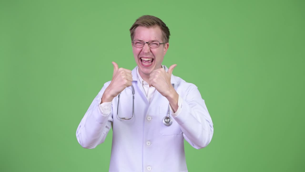 Young Man Doctor Making Thumbs Up Gesture