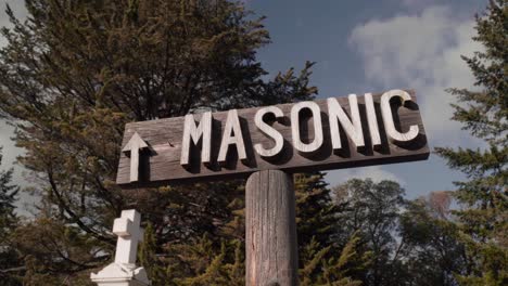 Wooden-Sign-in-Cemetery-Directing-to-the-Masonic-Section---4K