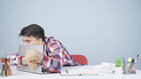 man joyfully embracing laptop.