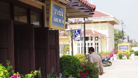 uniformed officer strolls by a floral station