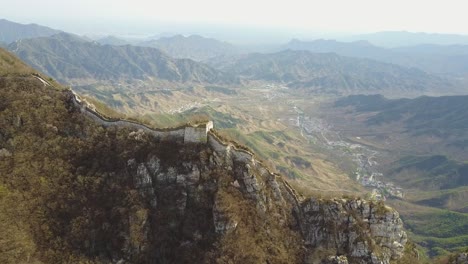 Villages-and-towns-seen-far-below-jagged-ridge-top-Great-Wall-of-China