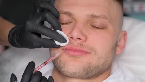 man receiving lip filler treatment