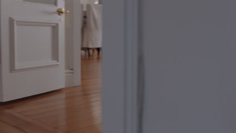 happy-little-girl-running-through-house-wearing-tutu-opening-curtains-looking-out-window-at-beautiful-new-day-with-bright-sunlight-playful-child-feeling-positive-4k-footage