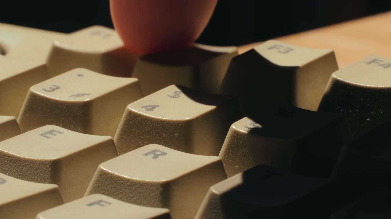 Man working and gaming on retro computer PC, IT engineer with vintage computer at home, using old fashion technology, close up of retro setup.