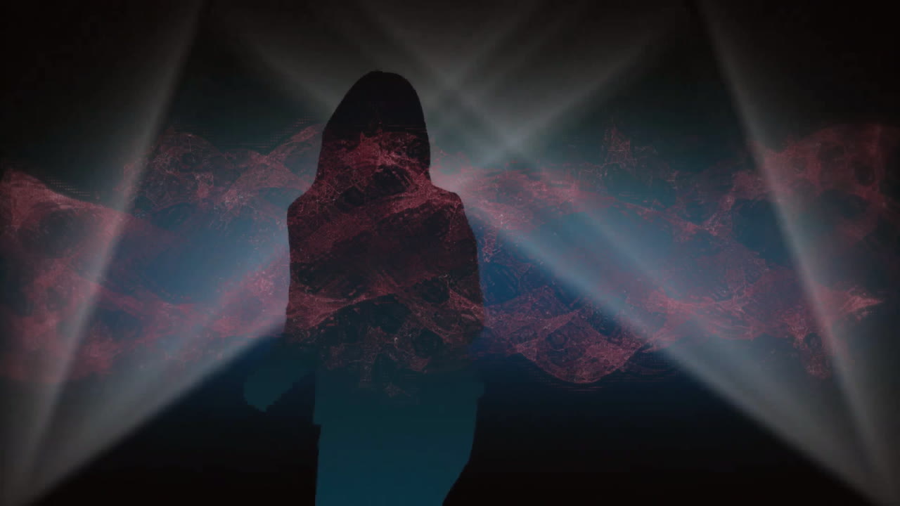 Silhouette figure standing on dark studio stage, showing red mesh wrapping torso and white beams