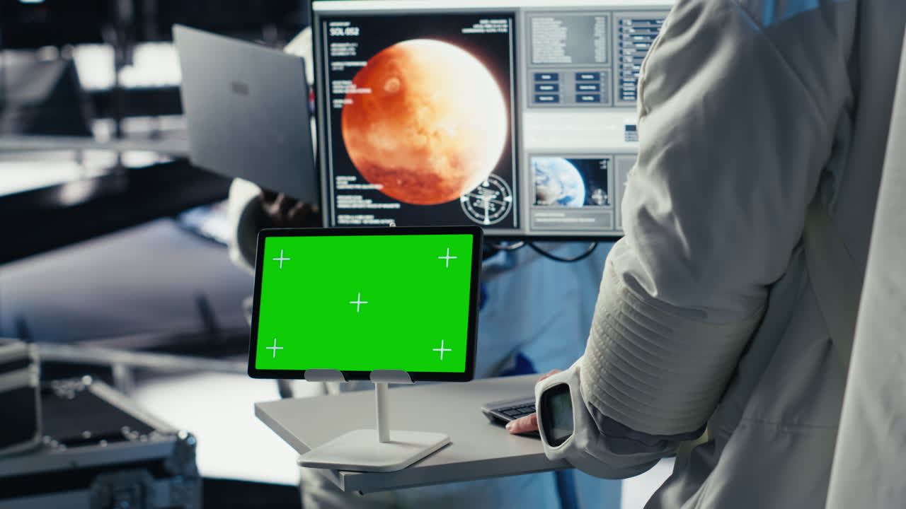 Astronaut monitoring system on isolated screen tablet, chatting with colleague